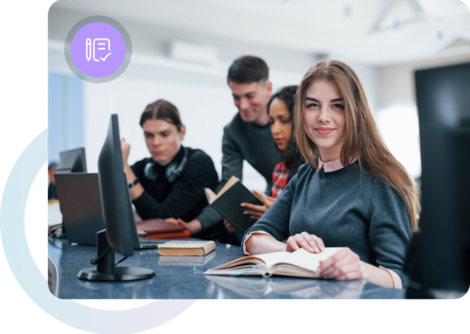 Group of 4 people learning in a computer lab with computers and books, purple circle with pencil and paper icon, blue and purple circle outline